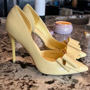 Yellow heels with bow , about 4in